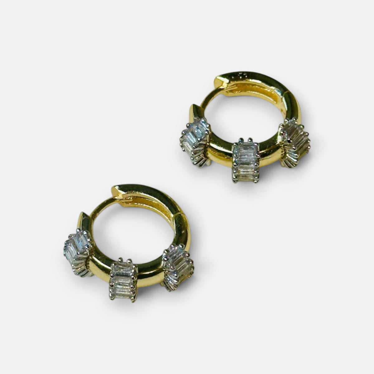 Jakris small gold hoop earrings featuring baguette-cut clear stones, perfect as a thoughtful Mother's Day gift.