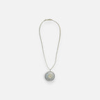 Jakris round pendant necklace featuring a sparkling star motif set with clear and yellow zircon stones on a fine chain