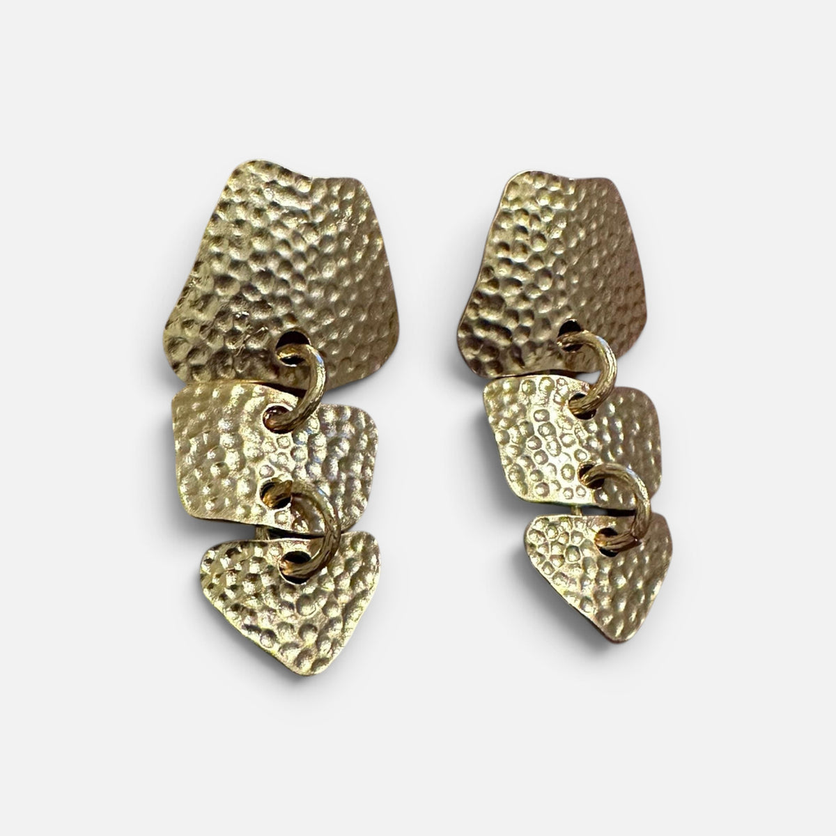Jakris gold-tone drop earrings featuring textured metal chain links in a modern layered design.