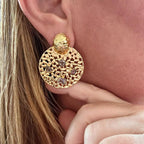 Jakris gold textured round earrings with intricate openwork patterns and small colourful gemstone accents