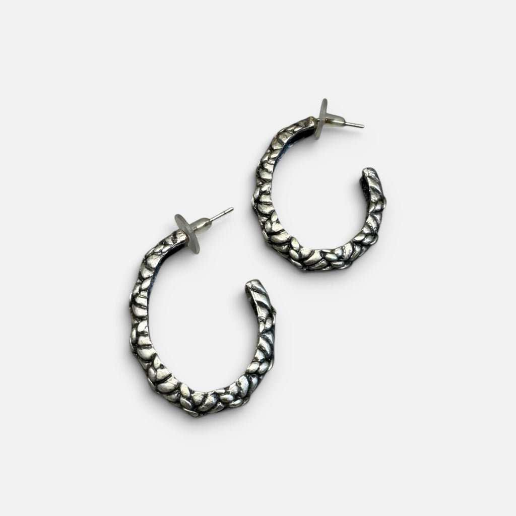 Jakris silver-plated hoop earrings with a textured surface and post back closure for a modern, stylish look.