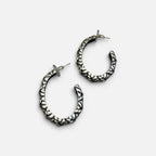 Jakris silver-plated hoop earrings with a textured surface and post back closure for a modern, stylish look.