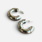 Jakris thick silver hoop earrings with gold-tone bamboo-style detailing and secure post backs.