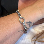 Jakris thick silver chain cuff bracelet with an open link design worn on a wrist