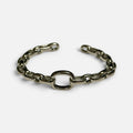 Jakris thick silver chain cuff bracelet with an open link design on a white background