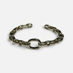 Jakris thick silver chain cuff bracelet with an open link design on a white background