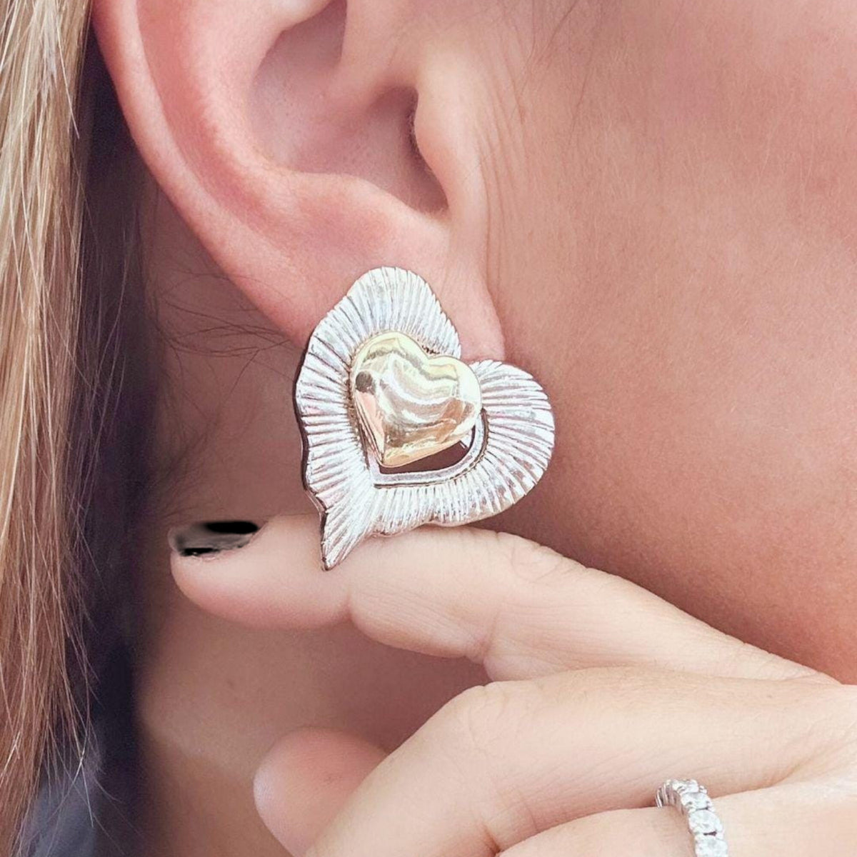 Jakris vintage style two-piece heart earrings with a silver textured outer heart and a polished gold inner heart.