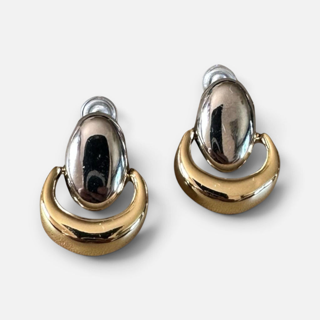 Jakris vintage two-tone shield dangle earrings featuring a polished silver oval and a gold crescent design.