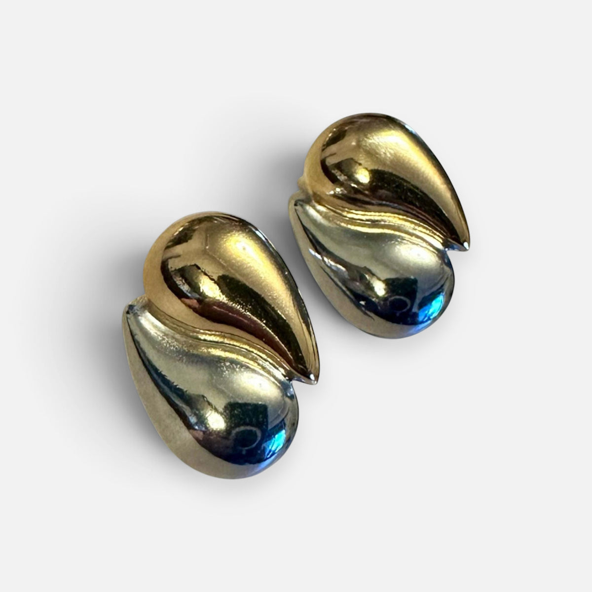 Jakris two-tone teardrop earrings featuring a polished gold and silver plated modern sculptural design