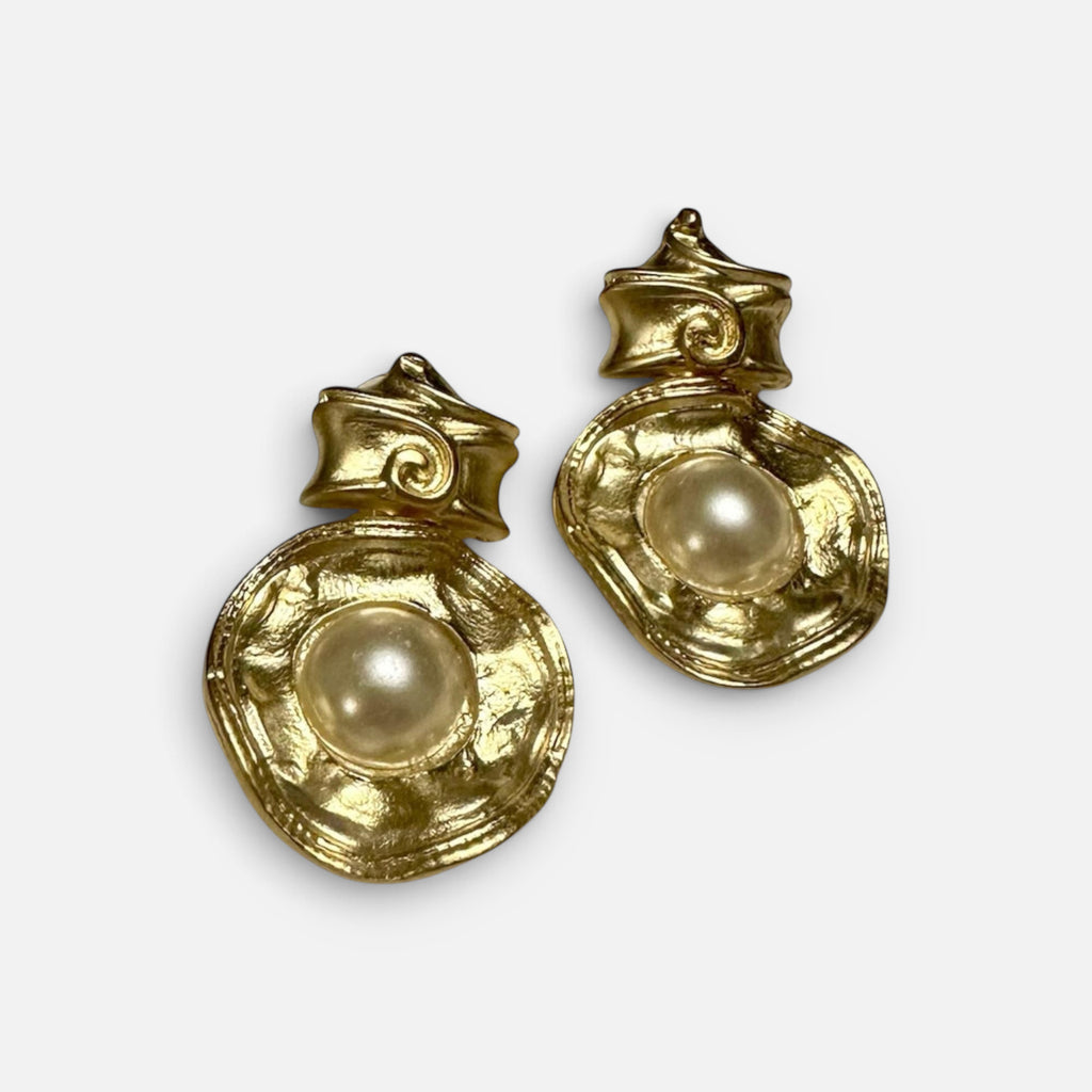 Jakris vintage-inspired gold earrings featuring a central pearl set in a textured, couture-style organic metal frame.