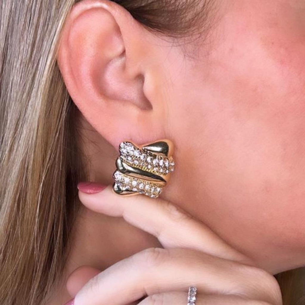 Jakris vintage style gold rectangular earrings featuring sparkling zircon stones worn on a woman's ear