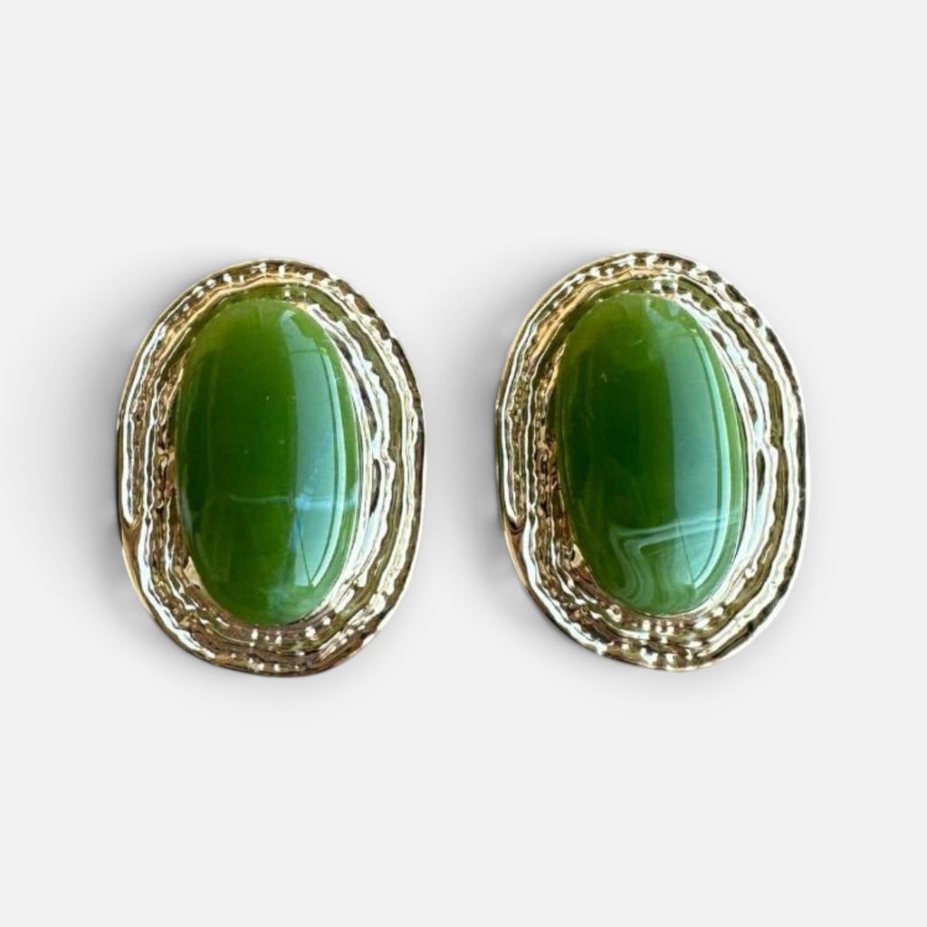 Jakris vintage-inspired oval earrings featuring a polished green stone set in a textured gold-tone frame