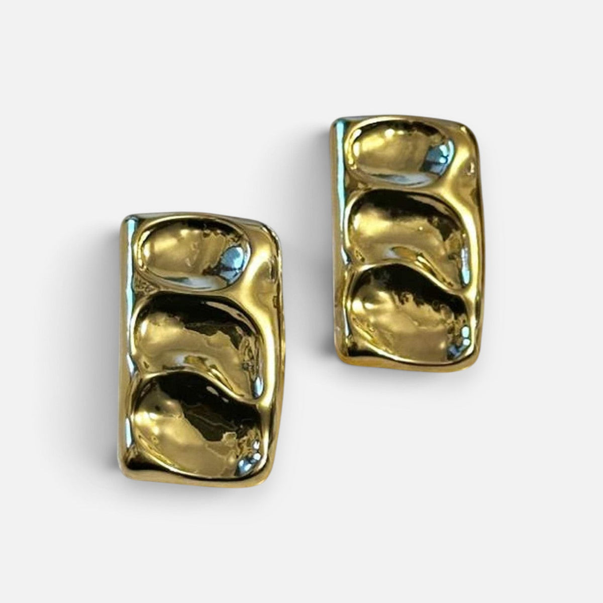Jakris gold rectangular earrings with a wavy, textured surface and a polished finish