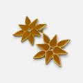 Jakris yellow enamel flower stud earrings with gold-tone metal detailing on a white background