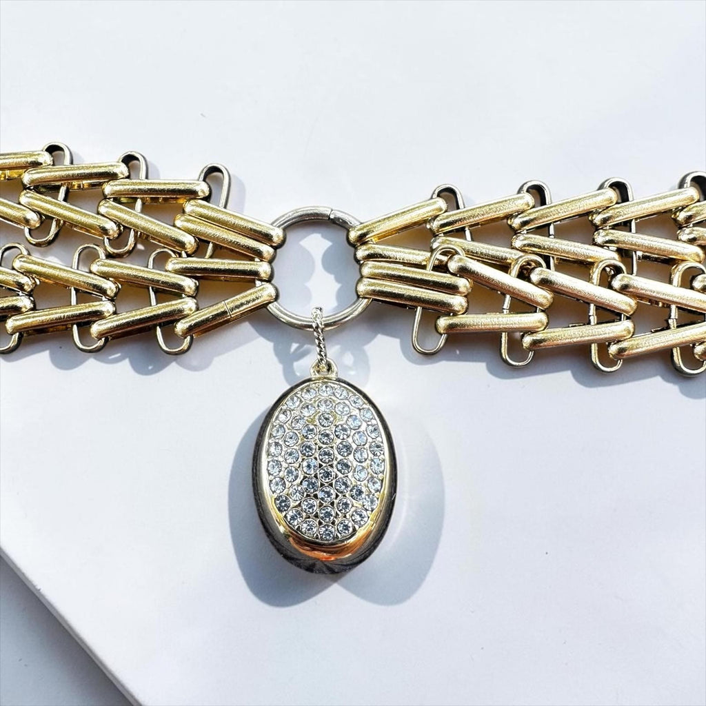 Jakris Zafira gold-tone multi-strand braided chain necklace with a central oval pendant featuring crystal embellishments