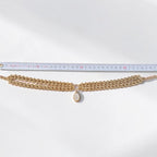 Jakris Zafira gold-plated brass multi-strand woven chain necklace with a crystal-embellished oval pendant