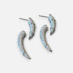 Jakris designer earrings featuring curved silver-tone metal encrusted with sparkling white zircon stones