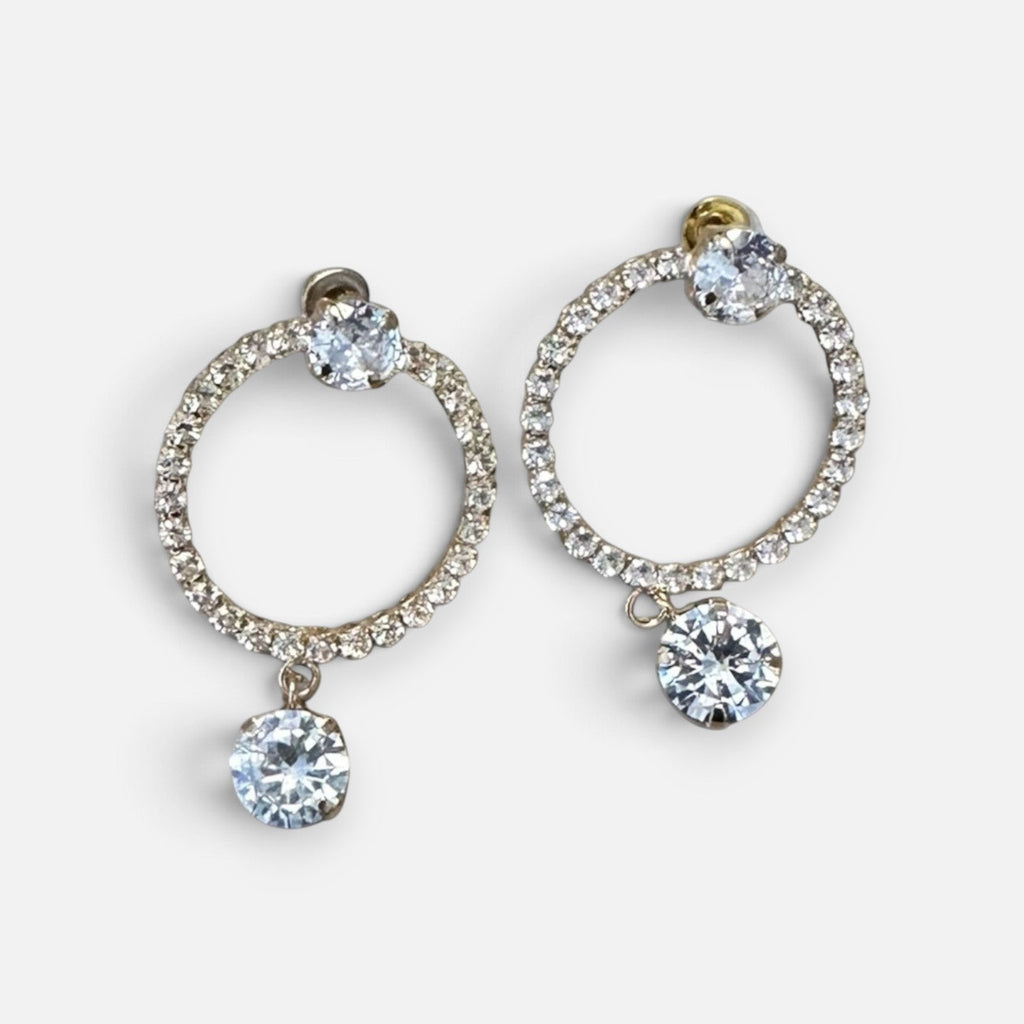 Jakris elegant hoop earrings featuring sparkling zircon stones and a dangling crystal charm for formal occasions